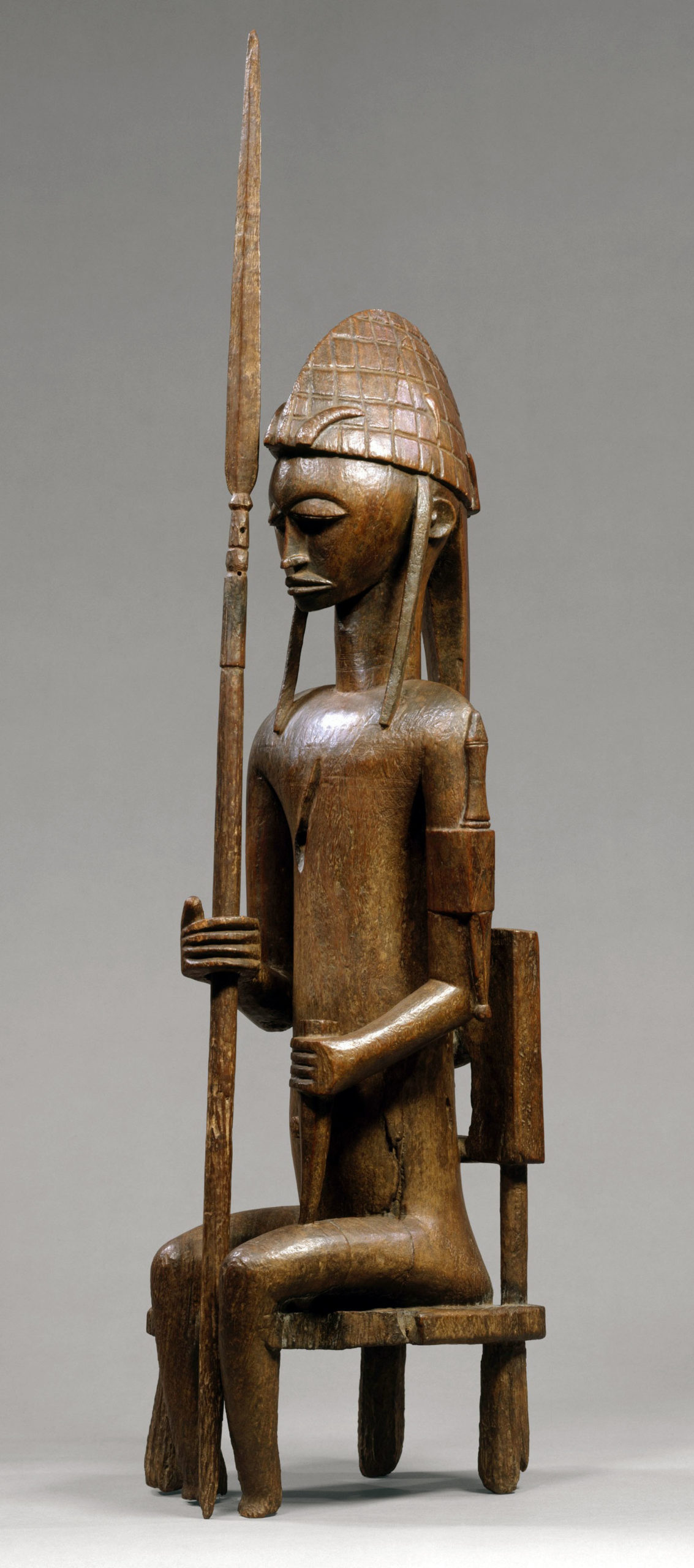 Seated Male with Lance (Gwantigi), 15th–20th century, wood, Mali, Bamana peoples, 89.9 cm high (The Metropolitan Museum of Art)
