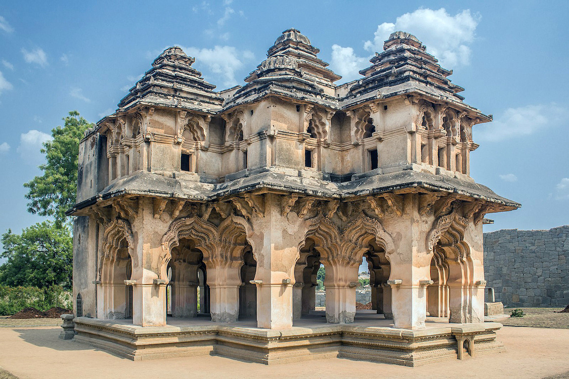 The "Lotus Mahal" is two-story pavilion that integrates design elements from temple architecture (the base, roof, and some stucco decorations) with features of Islamicate structures. This structure probably functioned as a reception hall or meeting place for the emperor and his advisors. “Lotus Mahal” in the city of Vijayanagara (present-day Hampi)  in the state of Karnataka in India, 16th century  (photo: Maheshwaran S, CC BY-SA 4.0)