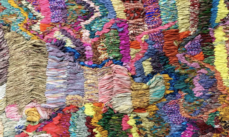 Suchitra Mattai, Exodus, 2019, vintage saris from India, Sharjah, artist’s Indo-Guyanese family and rope net, 15 x 40 ft (Collection of the Momentary, Crystal Bridges Museum of American Art)