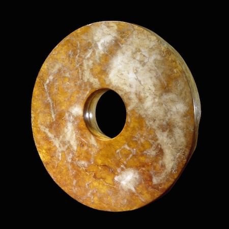 Jade disc, or bi, Liangzhu culture, c. 2500 B.C.E., 18 cm in diameter © Private Collection, © Trustees of the British Museum