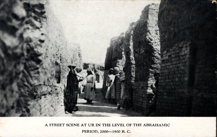 Postcard; printed; photograph showing archaeological excavations at Ur, with Arab workmen standing for scale in the excavated street of an early second millennium B.C.E. residential quarter © Trustees of the British Museum