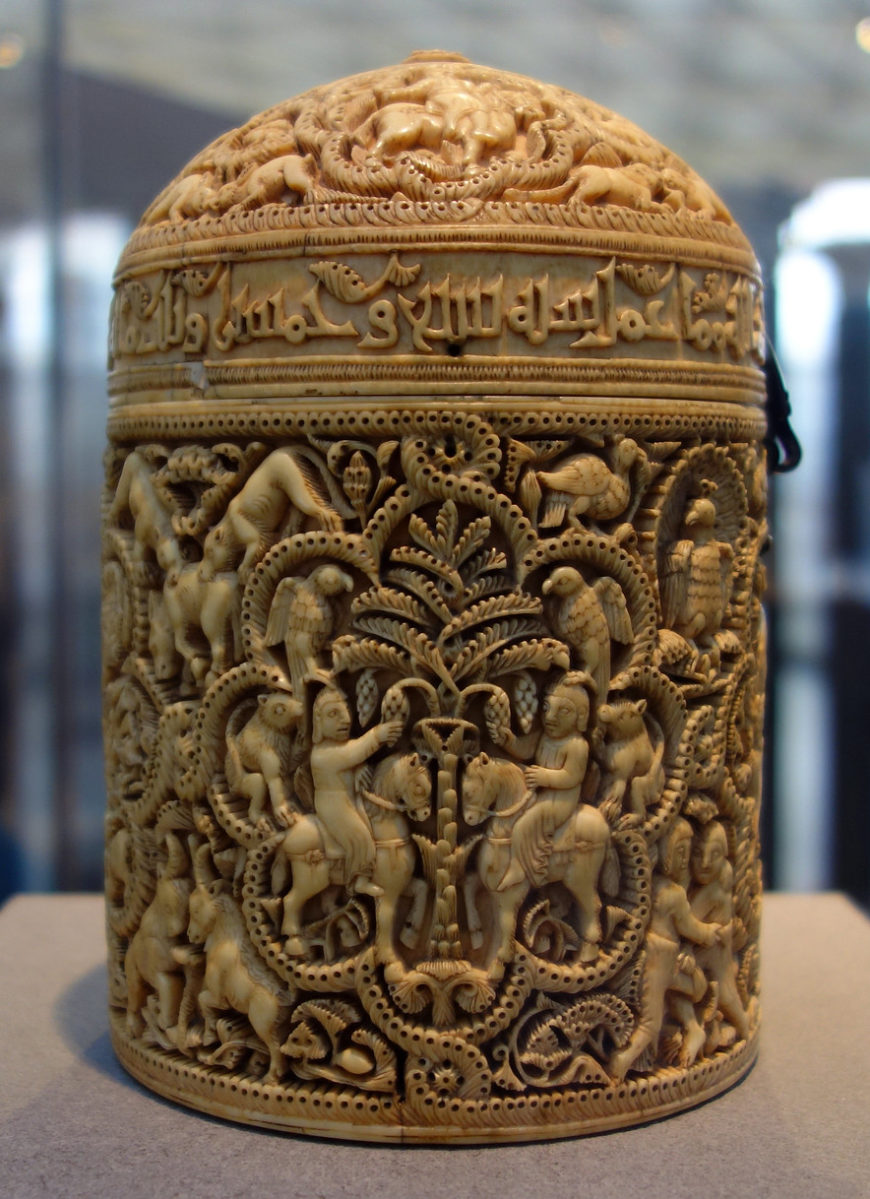 Pyxis of al-Mughira, possibly from Madinat al-Zahra, AH 357/ 968 CE, carved ivory with traces of jade, 16cm x 11.8 cm (Musée du Louvre, Paris) (photo: Steven Zucker, CC BY-NC-SA 2.0)
