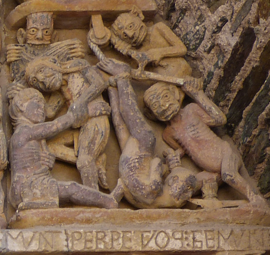 A gluttonous man hung by his legs and cloth stripped from the wealthy, Last Judgment tympanum, Church of Sainte‐Foy, France, Conques, c. 1050–1130 (photo: ricardo, CC BY 2.0)