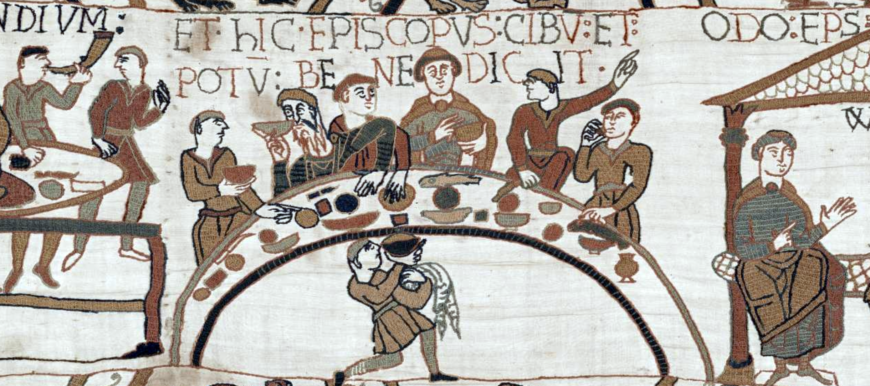 The Normans' first meal in England, at the center is Bishop Odo, who gazes out as he offers a blessing over the cup in his hand.(detail), Bayeux Tapestry, c. 1070, embroidered wool on linen, 20 inches high (Bayeux Tapestry Museum, Official digital representation of the Bayeux Tapestry—11th century. Credits: City of Bayeux, DRAC Normandie, University of Caen Normandie, CNRS, Ensicaen, Photos: 2017—La Fabrique de patrimoines en Normandie)