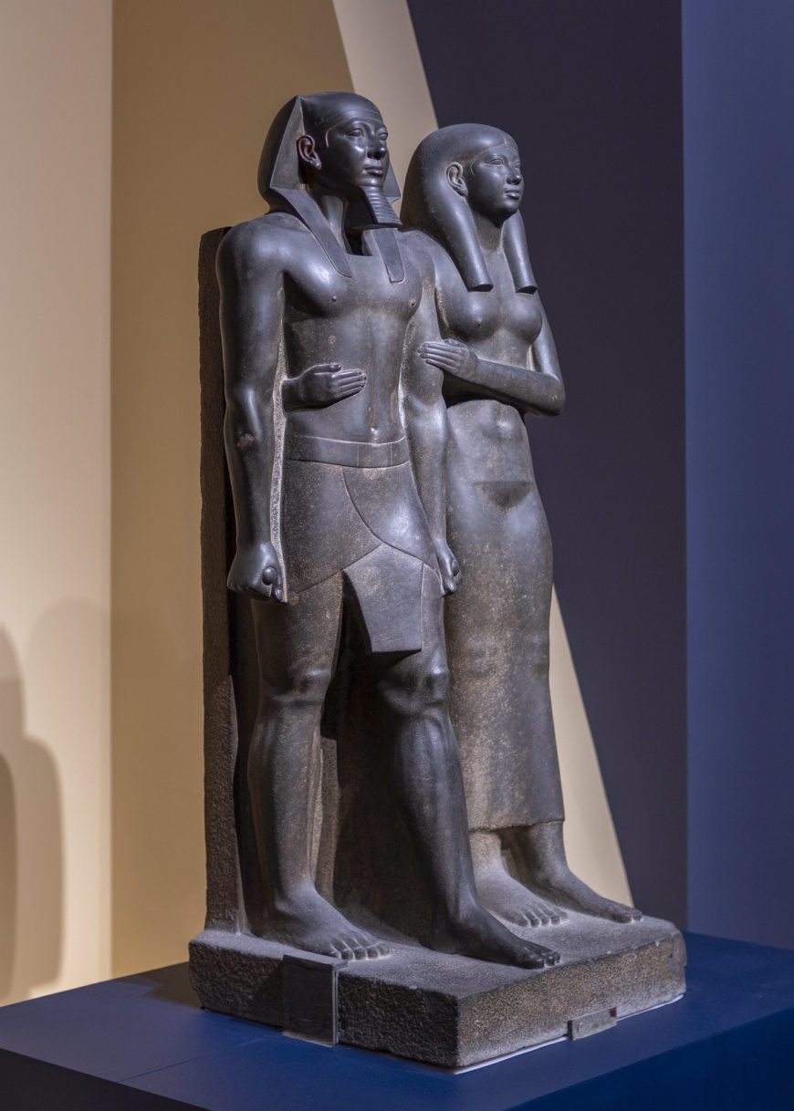 King Menkaure (Mycerinus) and queen, 2490–2472 B.C.E., greywacke, 142.2 x 57.1 x 55.2 cm (Museum of Fine Arts, Boston, photo: Steven Zucker, CC BY-NC-SA 2.0)