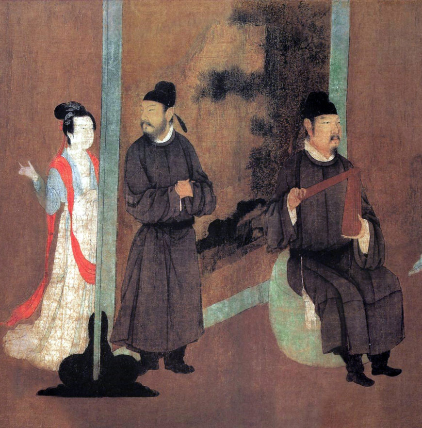 tail of a guest playing a clapper while another turns his head to a young woman on the other side of a screen, who gestures to a moment of impropriety Gu Hongzhong, detail of a screen, The Night Revels of Han Xizai, handscroll, 12th-century (Song dynasty) copy of a 10th-century (Southern Tang dynasty) composition), ink and color on silk, 28.7 x 335.5 cm (The Palace Museum, Beijing)