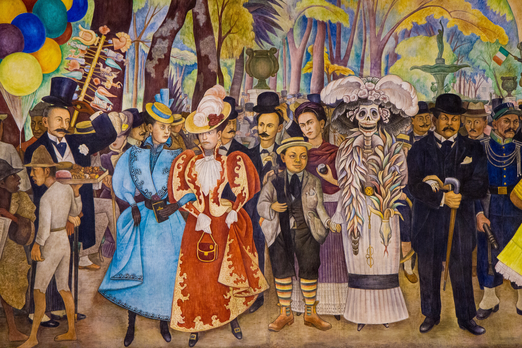 Diego Rivera, detail of central group with four rightmost figures (right to left) being the printmaker José Guadalupe Posada (right), La Catrina (the Skeleton), the painter Frida Kahlo (behind La Catrina), and the artist as a young man (in front of Kahlo), Dream of a Sunday Afternoon in Alameda Central Park (Sueño de una tarde dominical en la Alameda Central), 1947, 4.8 x 15 m (Museo Mural Diego Rivera, originally, Hotel del Prado, Mexico City; photo: Garrett Ziegler, CC BY-NC-ND 2.0)