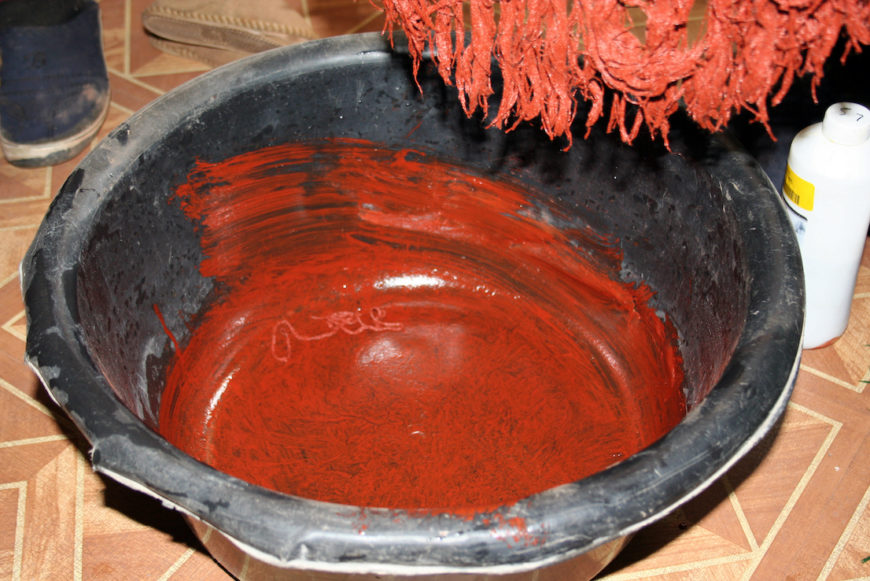 The fringe of a thethana being dyed with letsoku, 2008. Photo by David M. M. Riep