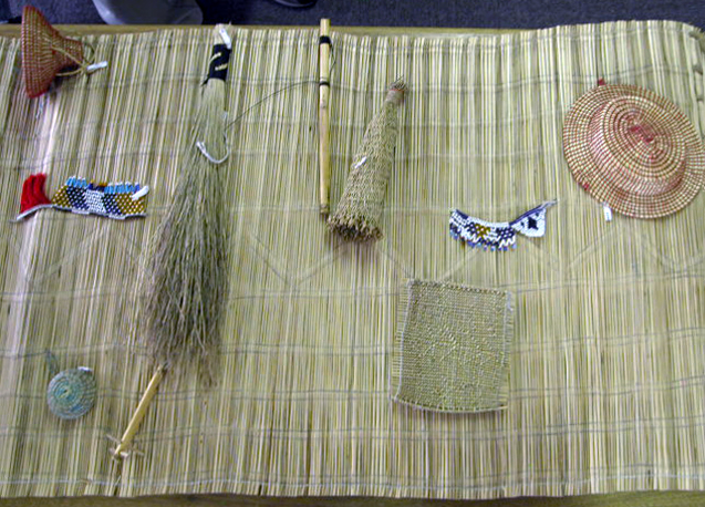 A tejana with miniature examples of women’s arts learned during lebollo. Photo by David M. M. Riep