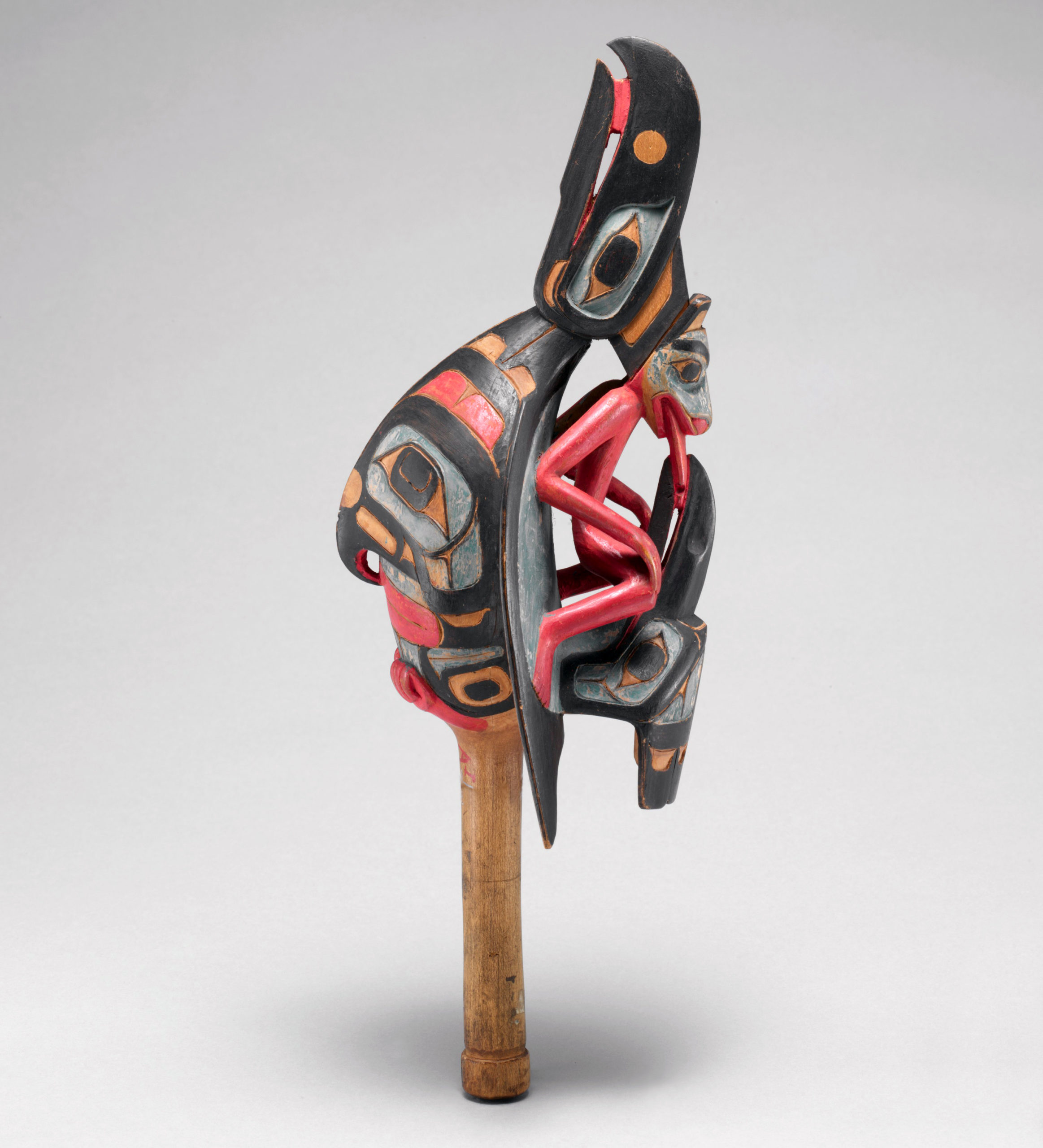 Raven rattle Native American (Tsimshian), 19th century, cedar, pebbles, polychrome, from Skidegate, British Columbia, Canada, 31 × 10.3 × 10.5 cm (The Metropolitan Museum of Art(