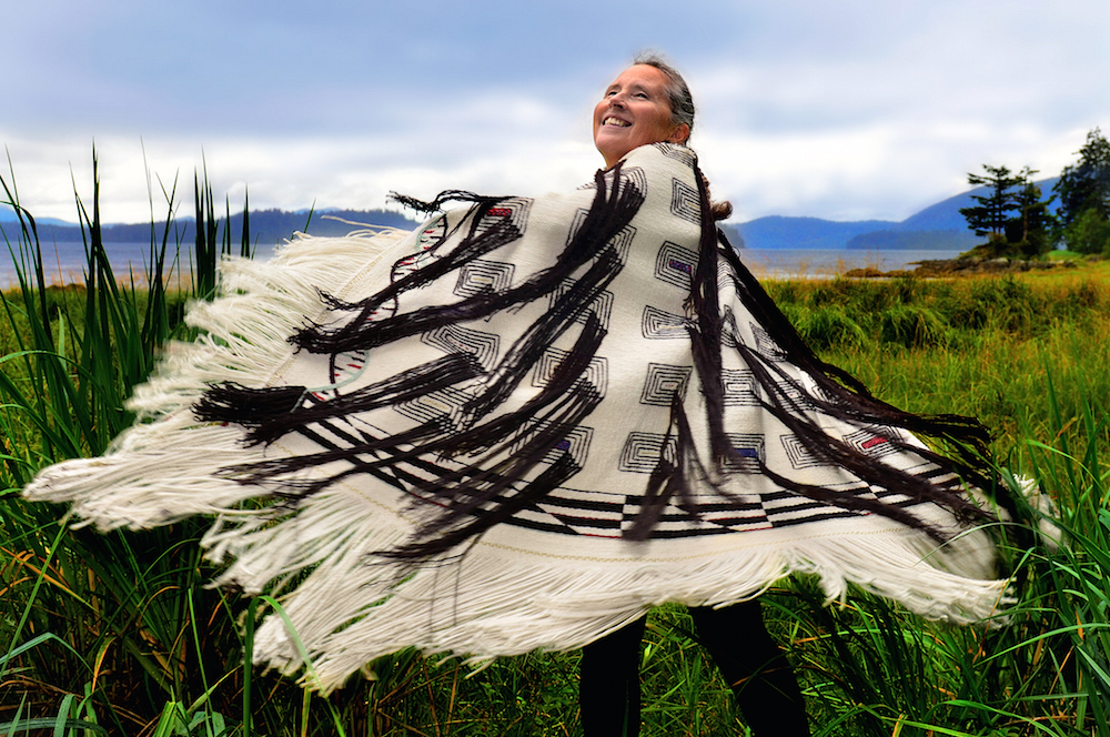 Teri Rofkar (Tlingit), wearing a Ravenʼs Tail robe that she wove, 2016 (photo: Tom Pich, CC0)