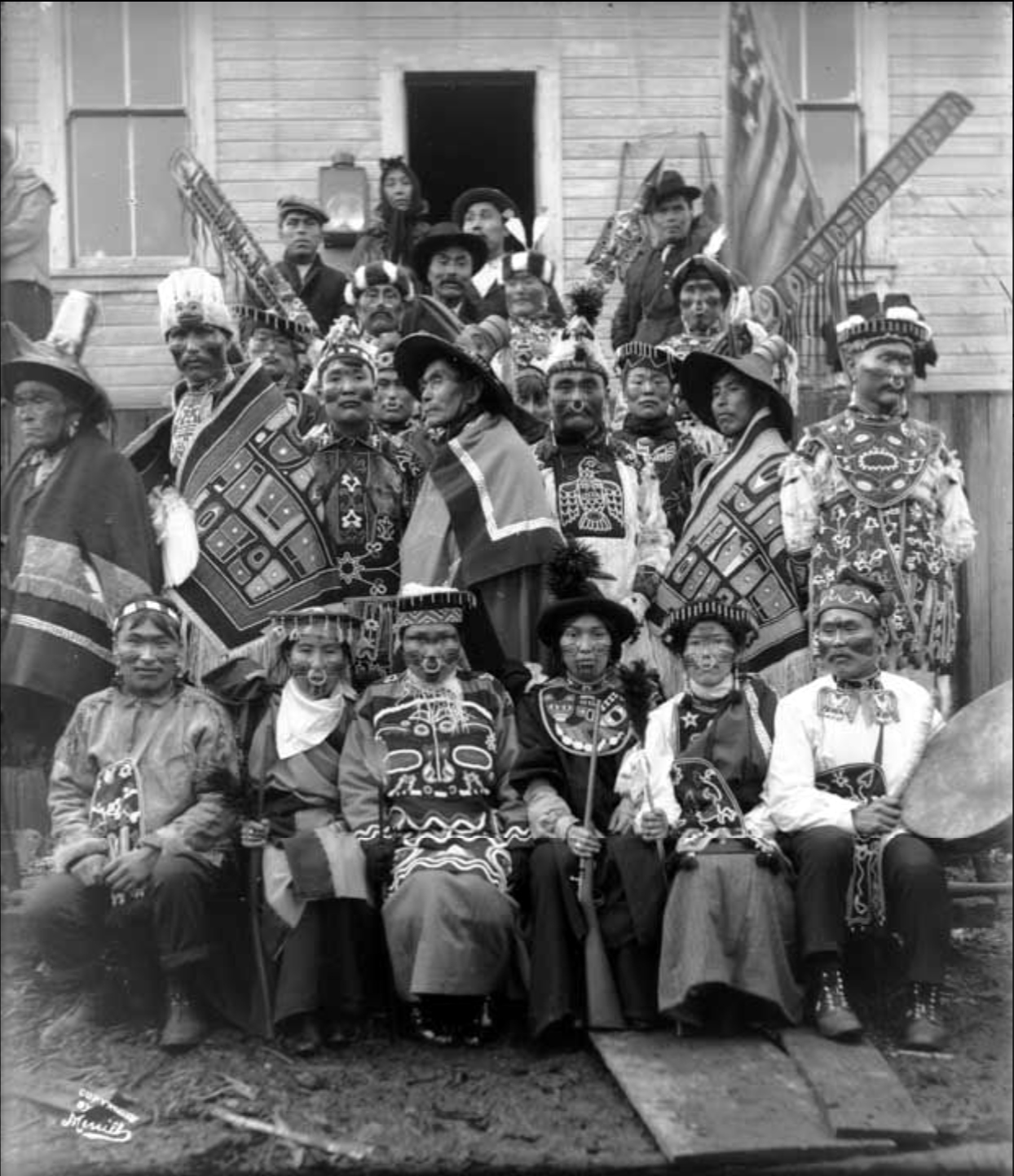 Tlingit guests at a potlatch in Sitka, Alaska, 1904, wearing naaxein robes and beaded regalia. Photo by Elbridge W. Merrill. Alaska State Library, P57-021