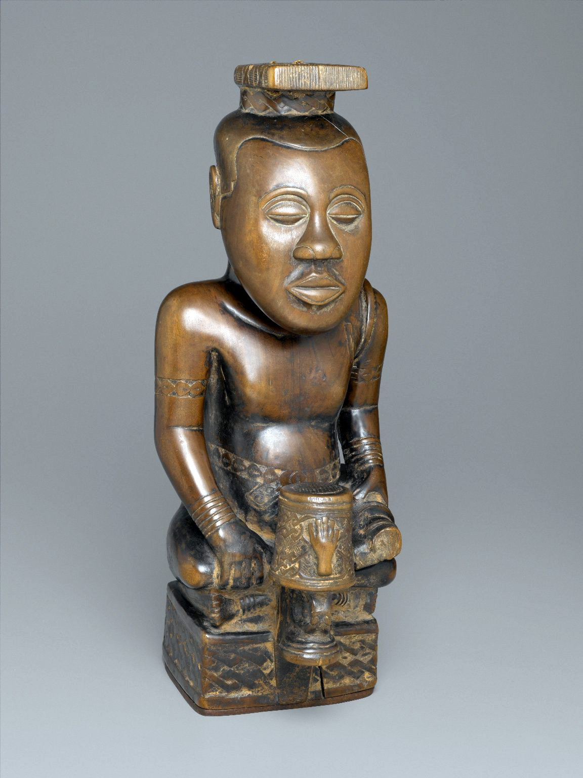 Ndop Portrait of King Mishe miShyaang maMbul, c. 1760-80, wood and camwood powder, 19-1/2 x 7-5/8 x 8-5/8" (Brooklyn Museum)