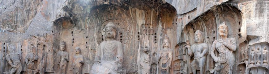 Central Vairocana Buddha surrounded on either side by a monk, bodhisattva, heavenly king, a Vajrapani (thunderbolt holder), 673–75 C.E., Tang dynasty, limestone, Luoyang, Henan province, (photo: Kevin Poh, CC BY 2.0)