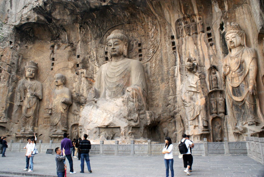 Vairocana Buddha, monks and bodhisattvas, 673–75 C.E., Tang dynasty, limestone, Luoyang, Henan province, (photo: Sanjay P. K., CC BY-NC-ND 2.0)
