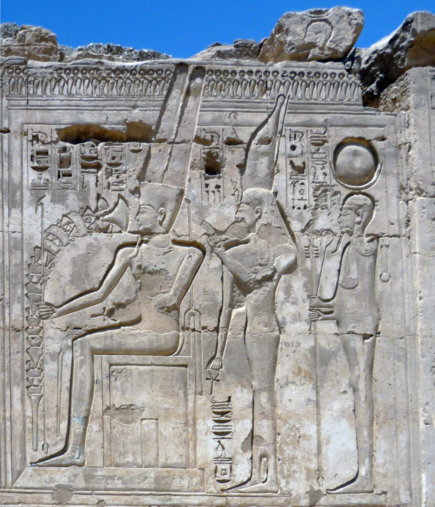 Wall relief of Amun-Ra, Mut and Khonsu (left to right), mortuary temple of Ramses III, Medinet Habu, Theban Necropolis, Egypt (photo: Rémih, CC BY-SA 3.0)