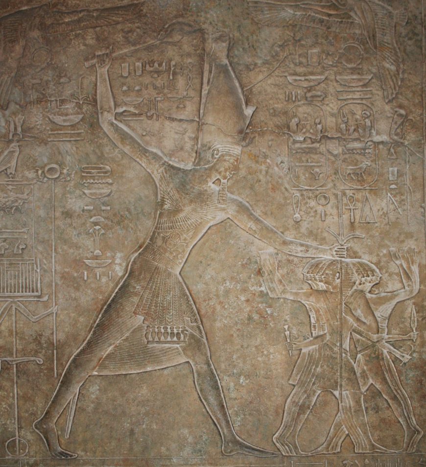 Western jamb of the south portal at the palace of Merenptah at Memphis showing the king in the iconic 'smiting' pose, controlling enemies of Egypt. Dynasty 19. (Penn E-13575-C)