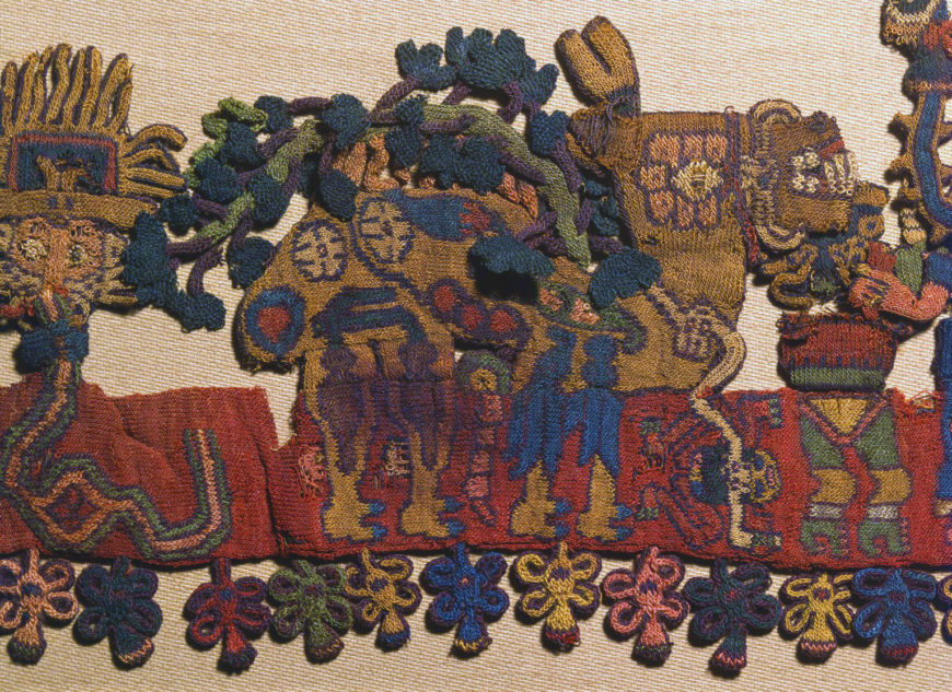 The llama is laden with a bounty of vegetables. Since pre-Columbian people had no wheeled vehicles for transport, llama caravans carried goods between regions. Border figure 26, Nazca, Mantle ("The Paracas Textile"), 100–300 C.E., cotton, camelid fiber, 58–1/4 x 24–1/2 inches / 148 x 62.2 cm, found south coast, Paracas, Peru (Brooklyn Museum)