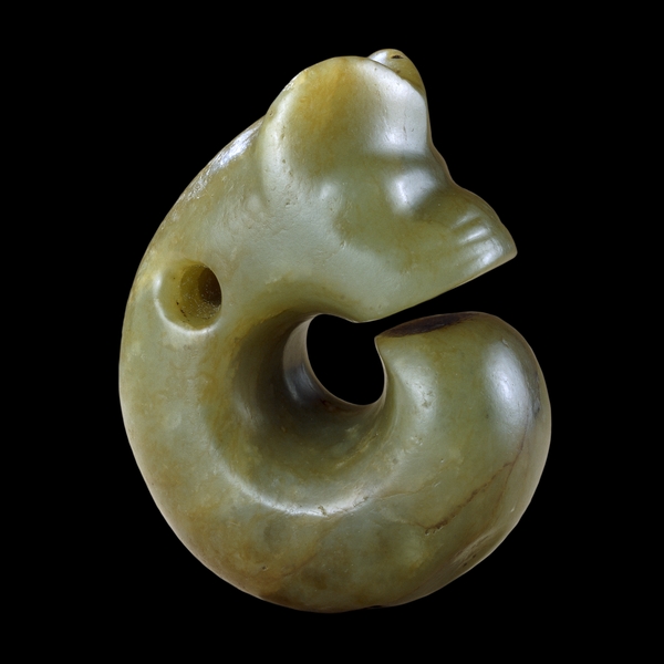 Jade coiled dragon, c. 3500 B.C.E., Neolithic period, Hongshan culture, 4.6 x 7.6 cm, China (© 2003 Private Collection, © Trustees of the British Museum)