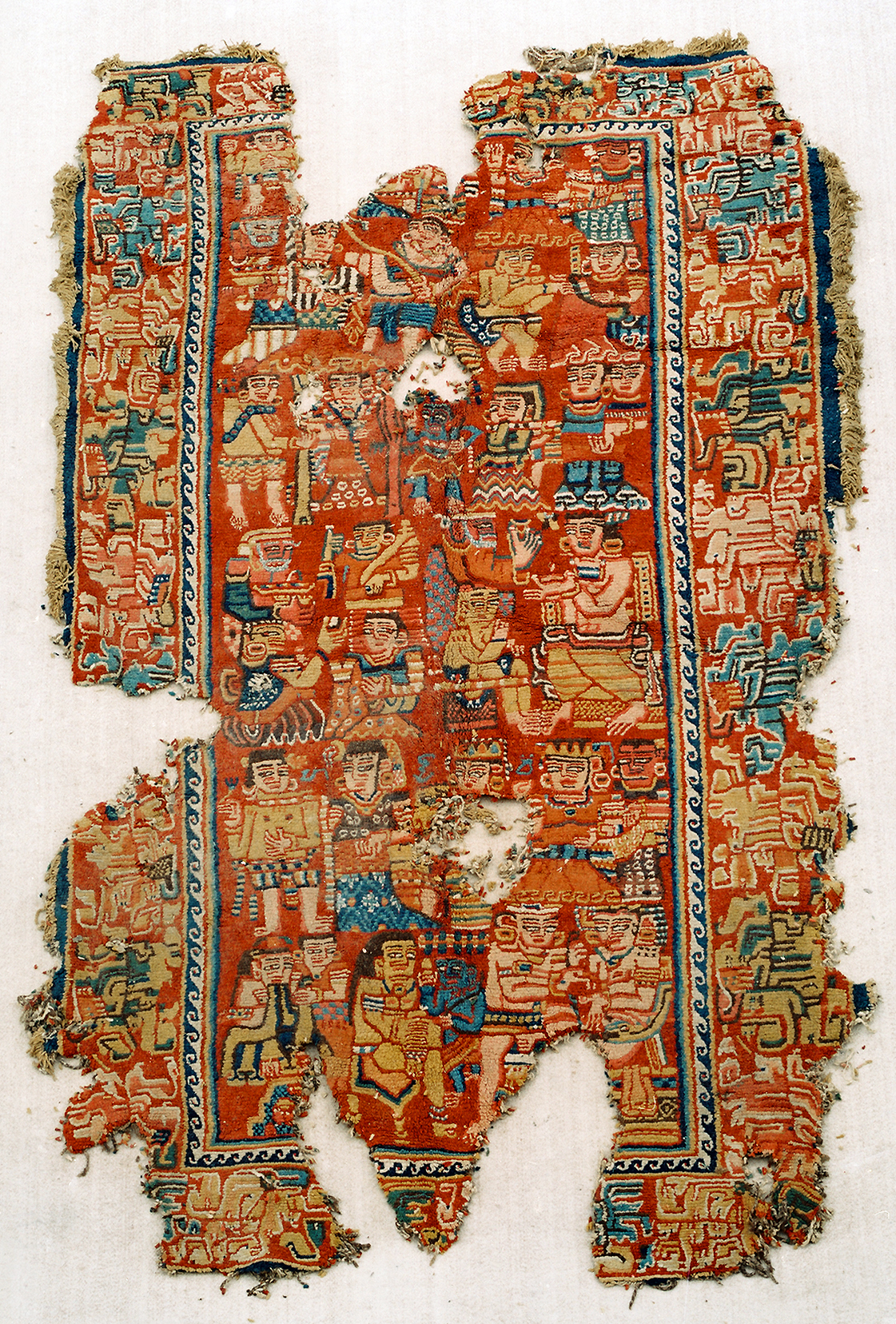 Knotted Carpet with human figures and Brahmi/Khotanese inscriptions, 5th–6th century C.E., Shanpula Township, Khotan District, Xinjiang Uygur Autonomous Region, China (photo: Qi Xiaoshan)