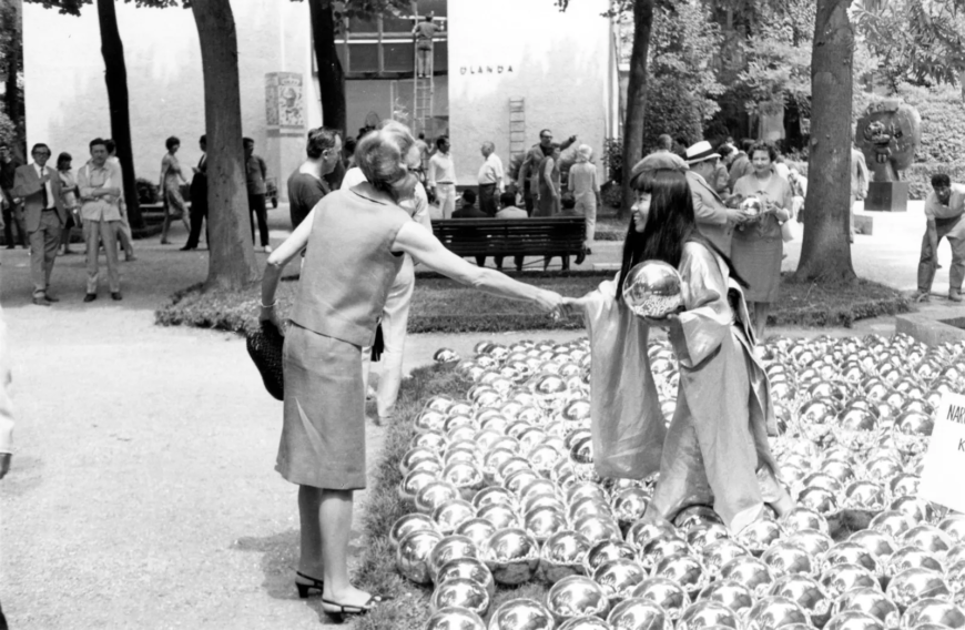 Yayoi Kusama with <em>Narcissus Garden</em>, 1966, installed in Venice Biennale, Italy, 1966 (photo: Yayoi Kusama Studio) © YAYOI KUSAMA. Courtesy David Zwirner, New York; Ota Fine Arts, Tokyo/Singapore/Shanghai; Victoria Miro, London/Venice.