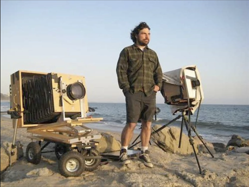 A shot of Chris McCaw at work on a beach in Santa Monica in the Los Angeles Times's Arts & Music section, accompanying an article on the photographer’s “Sunburns” exhibition (photo: Daniel Miller / Duncan Miller Gallery)
