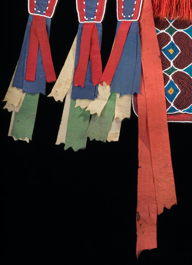 Silk ribbons (detail), bandolier bag, Lenape (Delaware tribe, Oklahoma), c. 1850, hide, cotton cloth, silk ribbon, glass beads, wool yarn, metal cones, 68 x 47 cm (National Museum of the American Indian, New York)