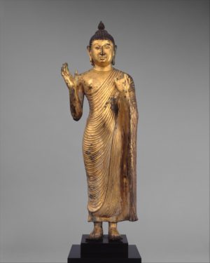 Buddha Offering Protection, 10th century, Sri Lanka, central plateau, copper alloy with gilding, 60.3 x 17.8 x 10.2 cm (The Metropolitan Museum of Art)