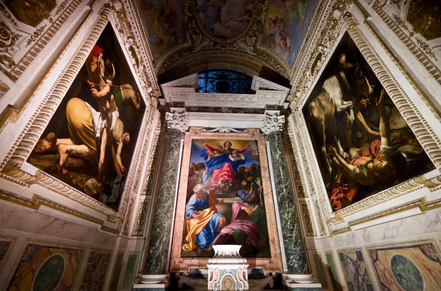 View of the Cerasi Chapel in Santa Maria del Popolo in Rome with Annibale Carracci's altarpiece, The Assumption of the Virgin, 1600–01, oil on canvas, 245 cm × 155 cm, and paintings by Caravaggio on the side walls (The Crucifixion of St. Peter on the left, and The Conversion of Paul on the right) (photo: Frederick Fenyvessy, CC BY 2.0)