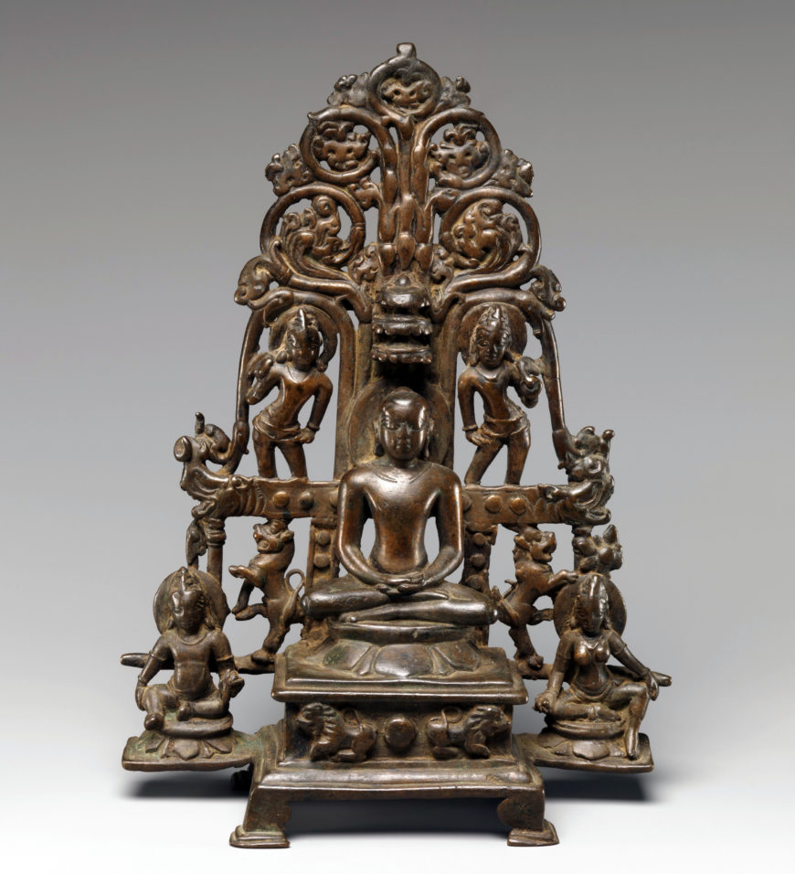 Enthroned Jina Attended by a Yaksha, a Yakshi, and Chauri-Bearers 9th–10th century, copper alloy, India (Karnataka), 24.8 cm high (The Metropolitan Museum of Art)