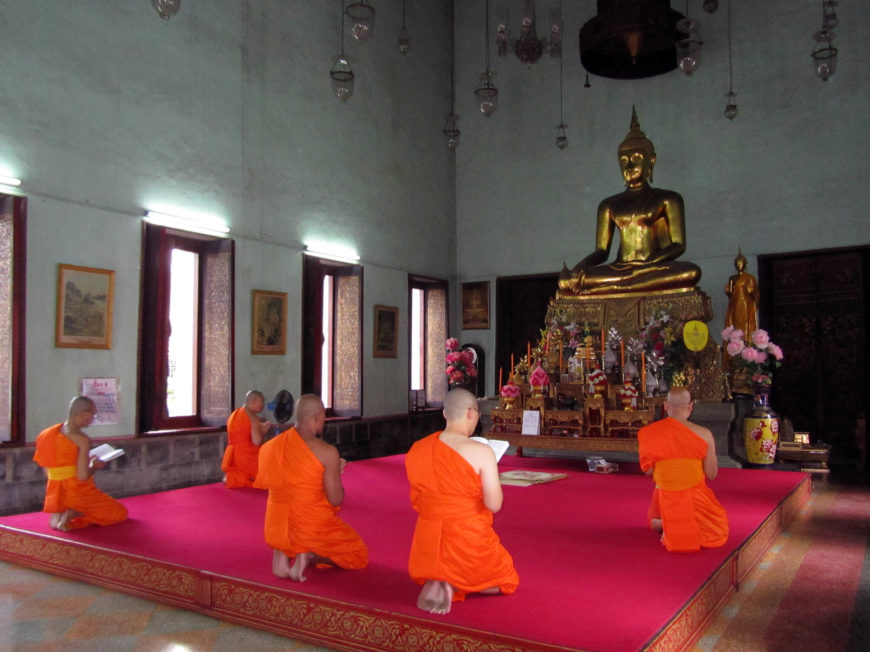 Monks chanting on an elevated dais in the ubosot of Wat Mahanpharam, Bangkok (photo by the author).