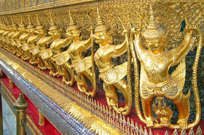 The central base of the Ubosot is decorated with a golden row of 112 Garudas, Wat Phra Kaew, Bangkok, Thailand (photo: Heinrich Damm, CC BY 2.0)