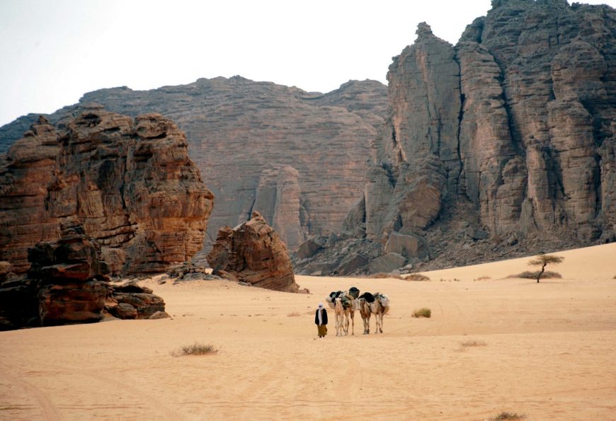 The Tassili plateau, hailed as “the greatest center of prehistoric art in the world:" undercuts at cliff bases have created rock shelters with smooth walls ideal for painting and engraving. The Tassili’s unique geological formations of eroded sandstone rock pillars and arches—“forests of stone”—resemble a lunar landscape. (photo: magharebia, CC BY 2.0)