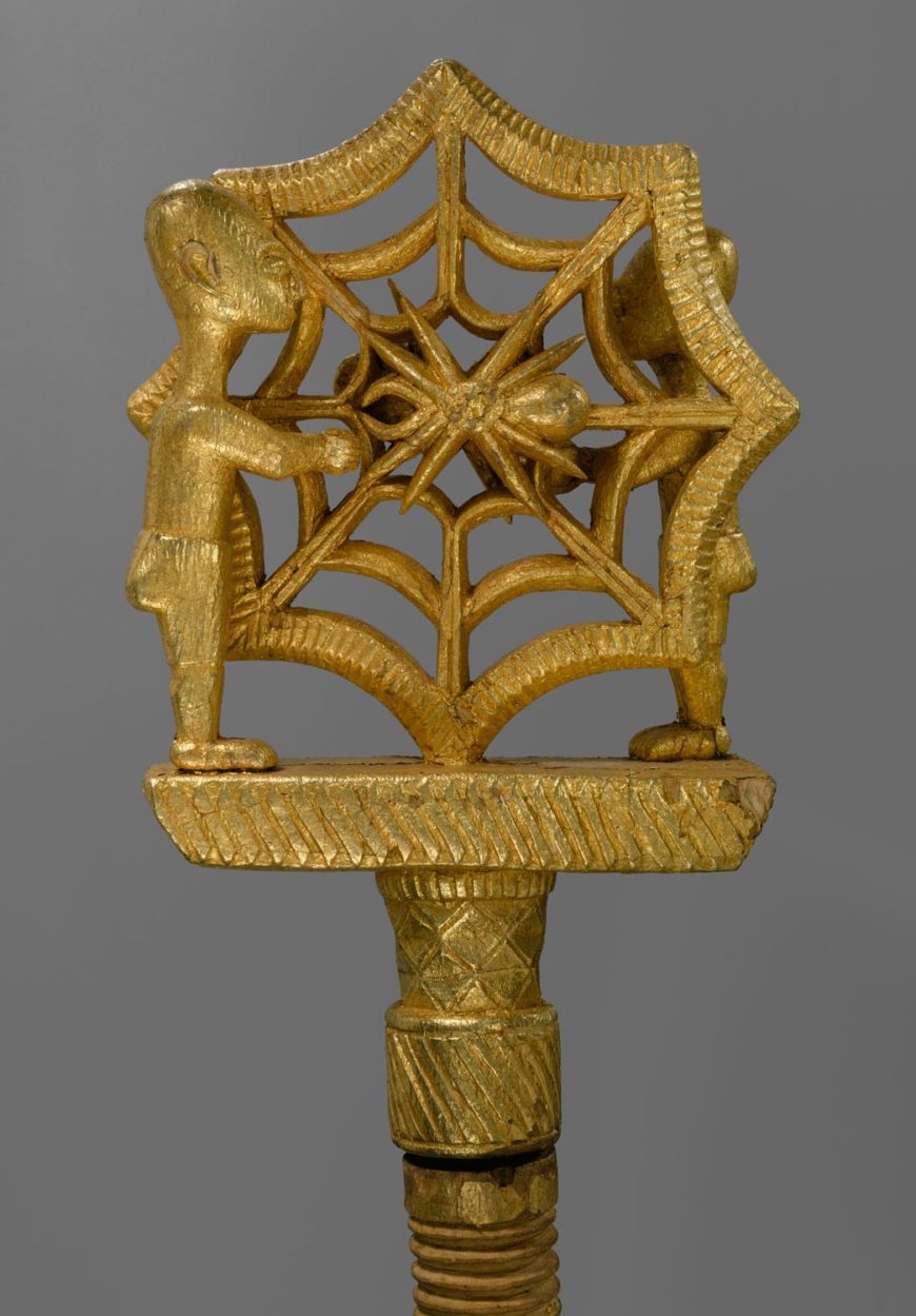 Staff of Office: Figures, spider web and spider motif (ȯkyeame) (detail), 19th–early 20th century, Ghana, Akan peoples, Asante, gold foil, wood, nails, 156.5 x 14.6 x 5.7 cm (The Metropolitan Museum of Art, New York)