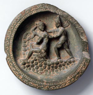 Carved into the face is a representation of Daphne turning to look back at the approaching figure of Apollo, a composition that reveals the artist’s familiarity with Hellenistic motifs and narrative structure, and perhaps even the story itself. Dish with Apollo and Daphne, c. 1st century B.C.E., schist, 10.6 cm in diameter, Pakistan (ancient region of Gandhara) (The Metropolitan Museum of Art)