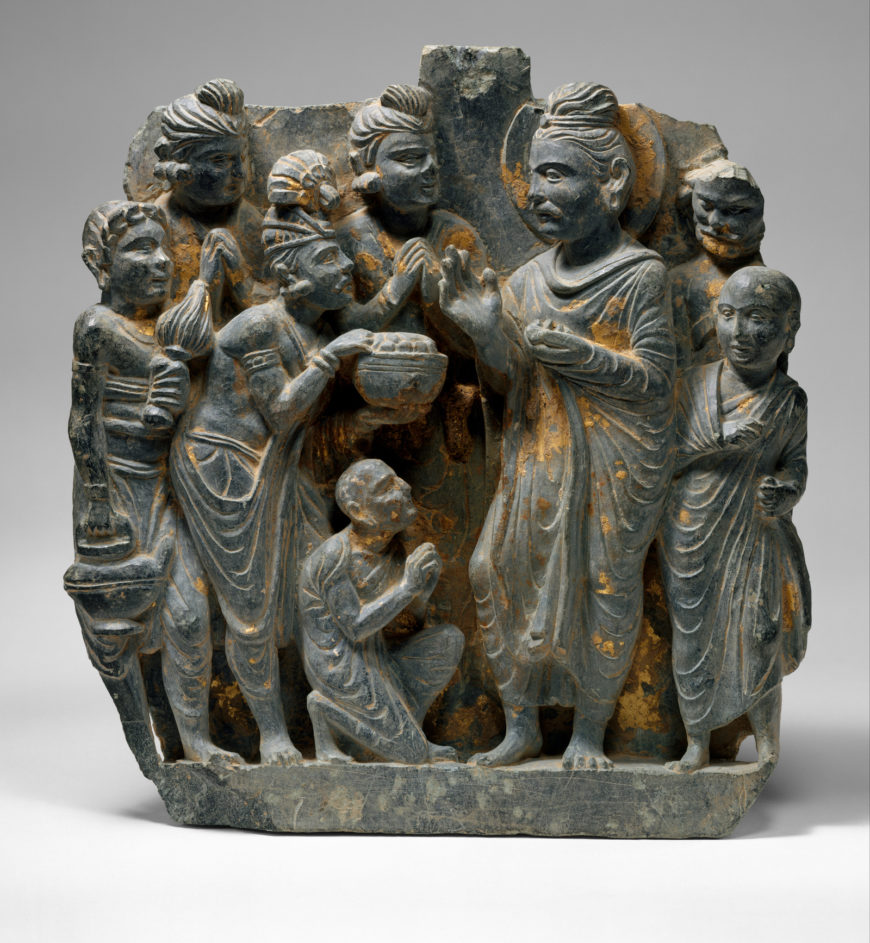 Scene from the life of Buddha (possibly the gift of Anathapindada), 2nd–3rd century, schist with traces of gold foil, 24.4 x 22.5 x 3.8 cm, Gandhara (Pakistan) (The Metropolitan Museum of Art)