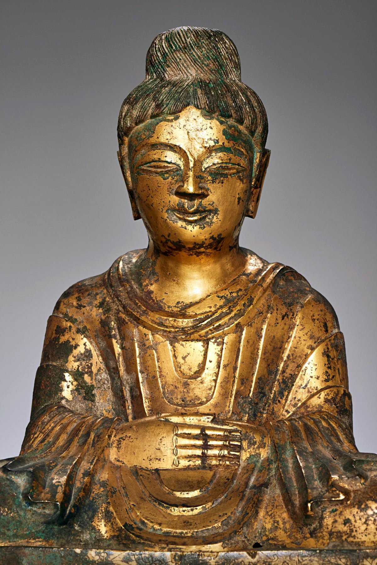 This is the earliest known dated Buddha sculpture produced in China, made 400 years after Buddhism was introduced there. Buddha, 338, Later Zhao Kingdom, bronze with gilding, China, Hebei province, 16 inches tall (Asian Art Museum)