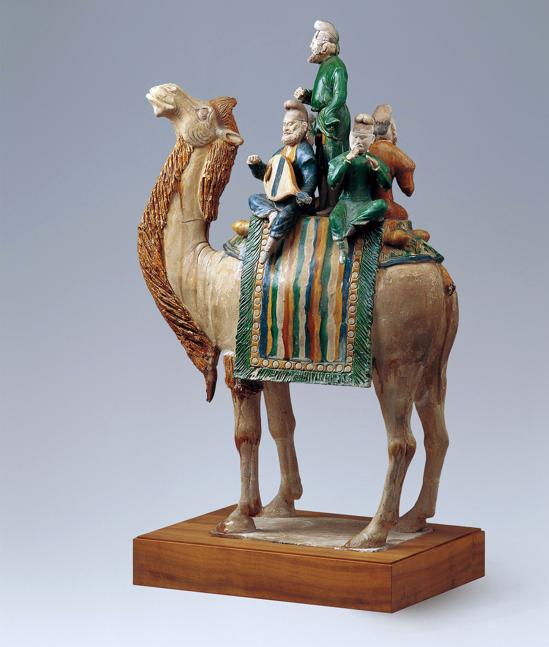 Musicians, likely Sogdians, are shown seated on a camel, Tang dynasty (618–907 C.E.), glazed earthenware, China, 58.4 cm high, excavated in 1957 from the tomb of Xianyu Tinghui, general of Yunhui, buried in western suburbs of Chang’an (Xi’an), dated to 723 C.E. (National Museum of China, Beijing)