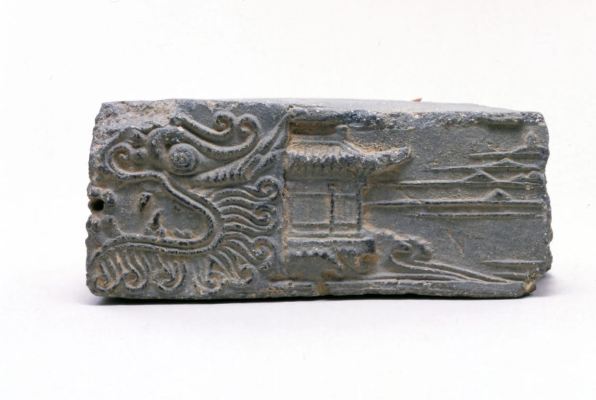 Earthenware brick with dragon, buildings, and landscape from Joongsan-ri, Ulsan, Unified Silla Period, 6.9 x 15.8 x 11.6 cm (Gyeongju National Museum)