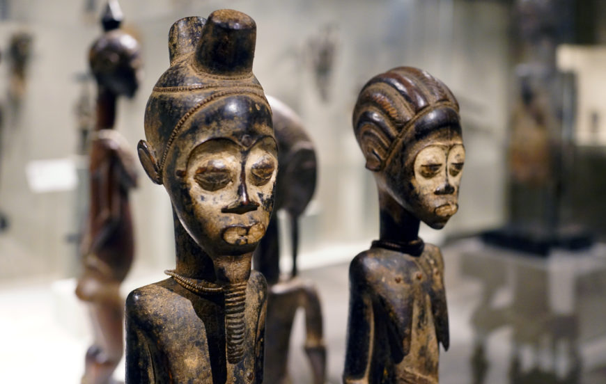 Faces (detail), Pair of Diviner's Figures, 19th–mid-20th century (Baule peoples, Côte d'Ivoire), wood, pigment, beads and iron, 55.4 x 10.2 x 10.5 cm (The Metropolitan Museum of Art; photo: Steven Zucker, CC BY-NC-SA 2.0)