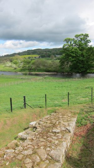 Remains of Hadrian’s Wall can still be seen descending toward the River North Tyne.