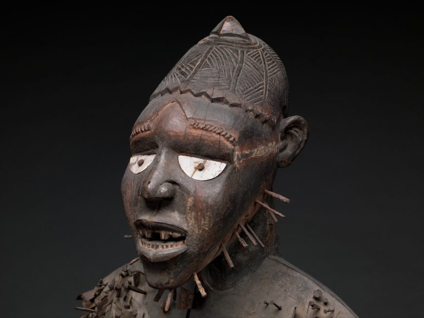 Face (detail), Power Figure (Nkisi N'Kondi: Mangaaka), Kongo peoples, mid to late nineteenth century, wood, paint, metal, resin, ceramic, 118 x 49.5 x 39.4 cm, Democratic Republic of Congo (The Metropolitan Museum of Art)