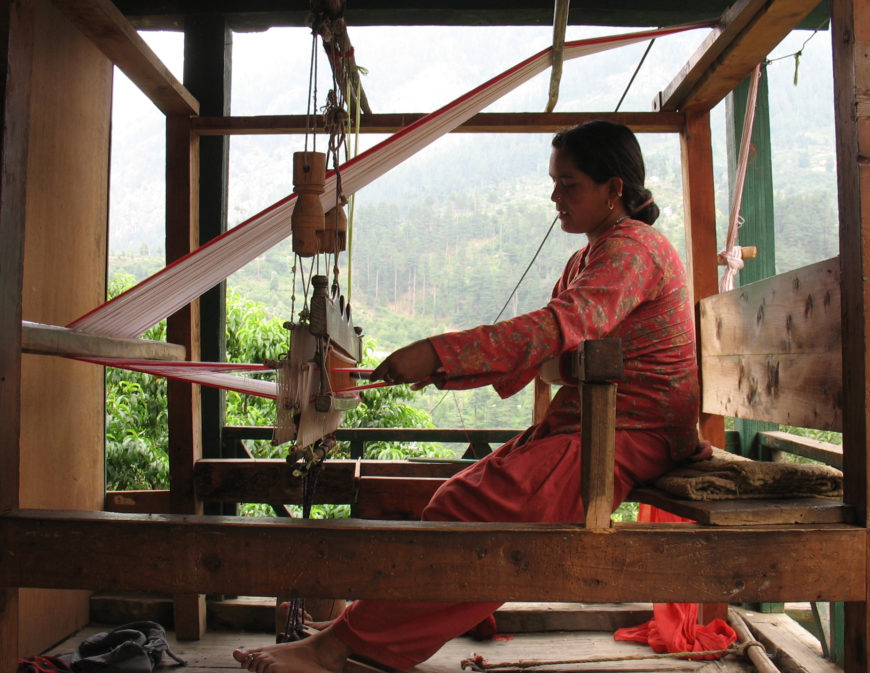 Weaver using a frame loom, Jari, India (photo: Shefshef)
