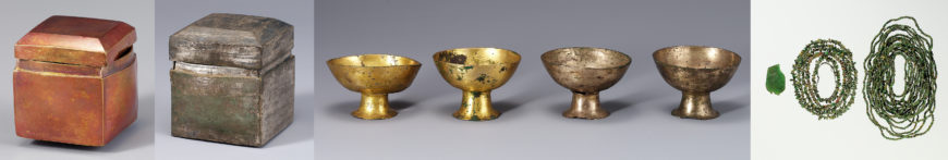 Reliquaries (from left to right): gold case, silver case, gold and silver mounted cups, and glass plate and glass beads from the stone pagoda in Guhwang-dong (National Museum of Korea)