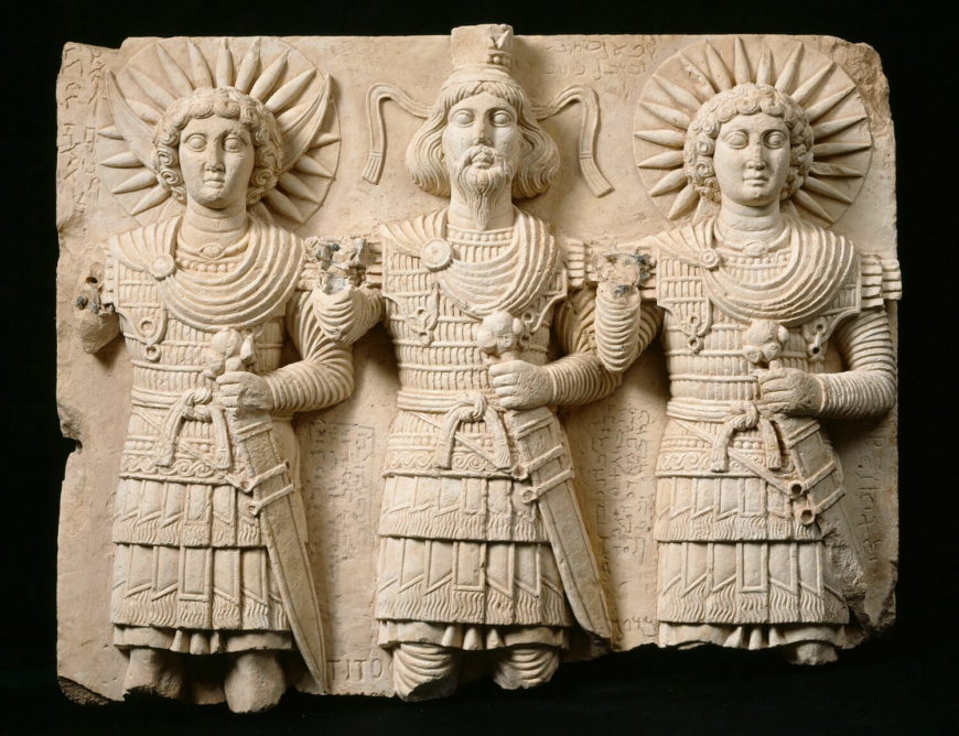Palmyra’s divine triad: Baalshamin, with the Moon god Aglibol on his right and the Sun-god Yarhibol at left, 1st century C.E., limestone, 60 cm high, discovered at Bir Wereb, near Palmyra (Musée du Louvre, Paris)