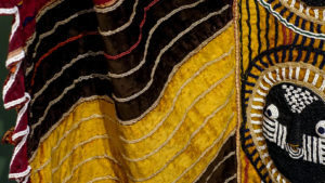 Ceremonial robe (agbádá ìlèkè), late 19th–early 20th centuries, unrecorded Yorùbá artists; Akúré, Ondo region, Nigeria, velvet, cotton, glass beads, 50 x 104 ½ inches (Newark Museum of Art)