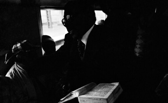Santu Mofokeng, "The Book, Johannesburg—Soweto Line," from the series Train Churches, 1986, gelatin-silver print, 19 x 28.5 cm (The Walther Collection) © Santu Mofokeng