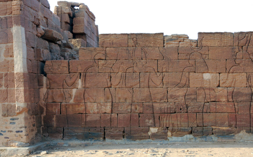 Queen Amanitore, King Natakamani, and their heir face and worship Isis and other goddesses from the side of the Lion Temple, Naga, Sudan (Photos: Karla Kroeper/Naga Project)