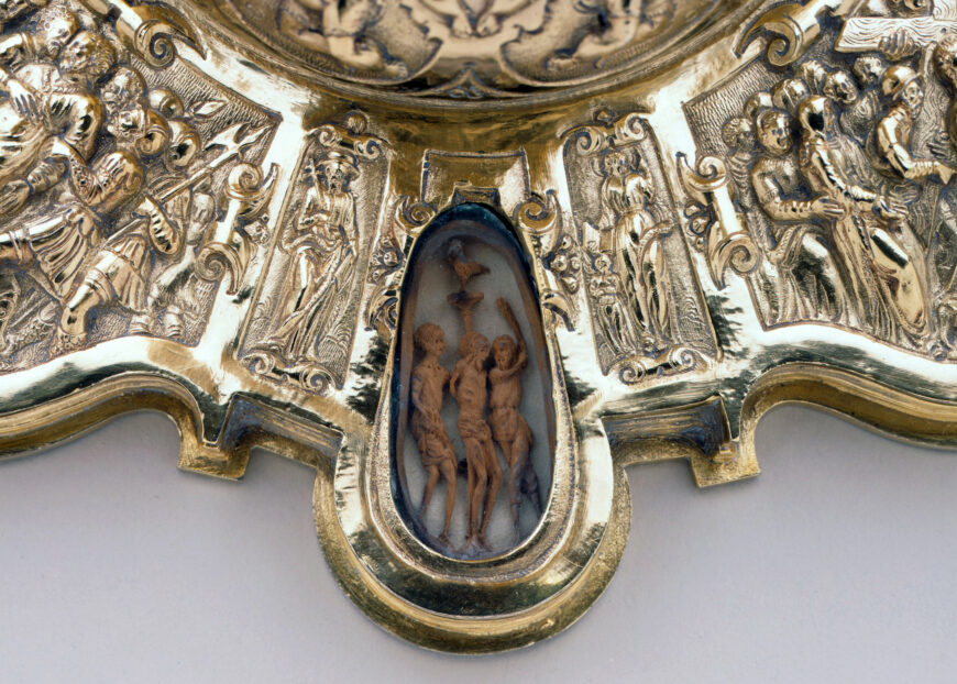 Detail of boxwood carving of the flagellation of Christ (one of the Stations of the Cross). Chalice ("Hearst Chalice"), unidentified artists, 1575–78, silver gilt, rock crystal, wood, and feathers, made in Mexico City, 33 cm high, 22.9 cm diameter (LACMA)