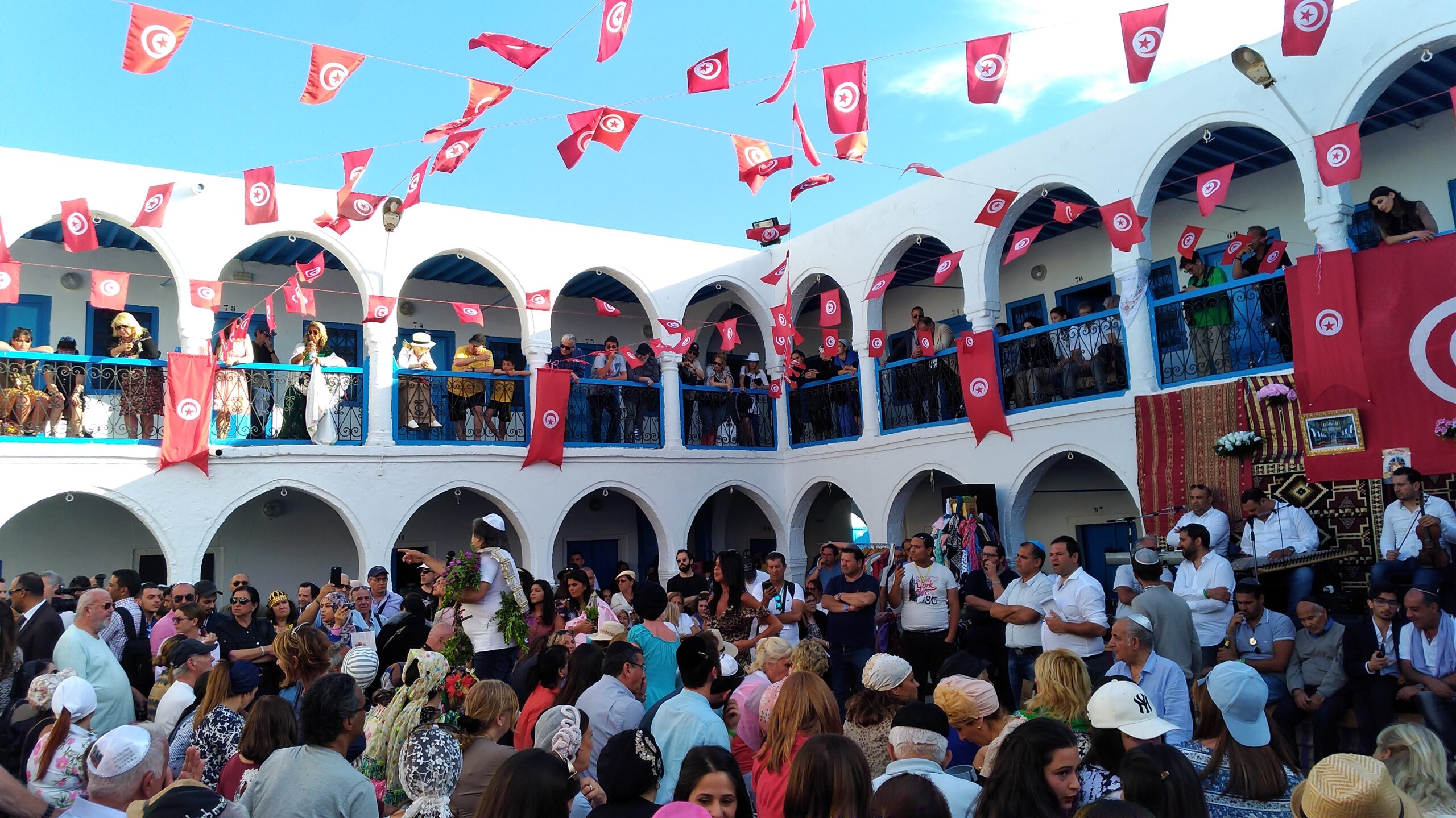 Oukala filled with pilgrims for the annual auction to add scarves to the menara and the right to push the menara during the procession (photo: Zied Touzani, Wikimedia Commons)
